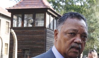 The American civil rights activist Rev. Jesse Jackson visits the former Nazi death camp of Auschwitz-Birkenau in Oswiecim, Poland on Friday, Aug. 2, 2019. Rev. Jesse Jackson gathered Friday with survivors at the former Nazi death camp of Auschwitz-Birkenau to commemorate an often forgotten genocide — that of the Roma people. In addition to the 6 million Jews killed in camps such as Auschwitz, the Nazis killed other minorities during World War II, including between 250,000 and 500,000 Roma and Sinti. (AP Photo/Czarek Sokolowski)