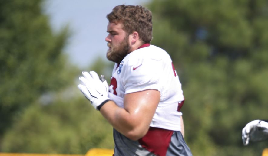 Washington Redskins offensive guard Wes Martin (78) does a warm up drill during the Washington Redskins NFL football training camp in Richmond, Va., Wednesday, July 31, 2019. Redskins rookie guard Wes Martin isn&#39;t just a strong NFL prospect who built his strength growing up on a dairy farm. He started a dog rescue foundation and raised money for it at his pre-draft pro day. (AP Photo/Steve Helber) ** FILE **