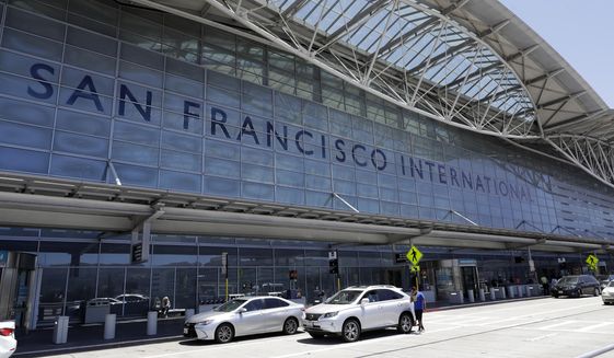 In this July 11, 2017, file photo, vehicles wait outside the international terminal at San Francisco International Airport in San Francisco. (AP Photo/Marcio Jose Sanchez, File)
