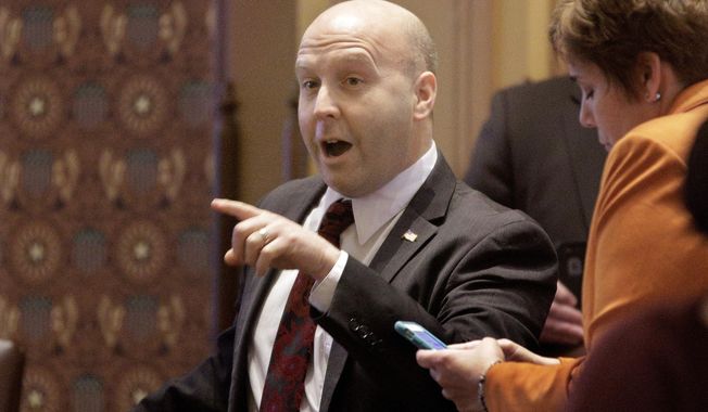 FILE--In this Dec. 7, 2015, file photo, Illinois Sen. Thomas Cullerton, D-Villa Park, speaks to lawmakers while on the Senate floor during session at the Illinois State Capitol, in Springfield, Ill. Cullerton has been indicted by a federal grand jury on charges that he took benefits and salary from the Teamsters while doing little or no work. On Friday, Aug. 2, 2019 federal prosecutors in Chicago announced that Cullerton, 49, is charged with 39 counts of embezzlement from a labor union, one count of conspiracy to embezzle from a labor union and an employee benefit plans and one count of making false statements in a health care matter. (AP Photo/Seth Perlman, File)