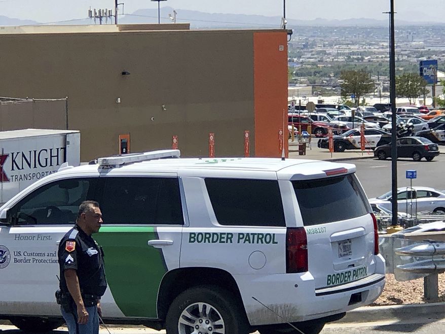 Law enforcement work the scene of a shooting  at a shopping mall in El Paso, Texas, on Saturday, Aug. 3, 2019.   Multiple people were killed and one person was in custody after a shooter went on a rampage at a shopping mall, police in the Texas border town of El Paso said. (AP Photo/Rudy Gutierrez)