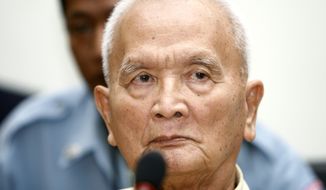 FILE - In this March, 20, 2008 file photo, former Khmer Rouge&#x27;s chief ideologist and No. 2 leader, Nuon Chea, foreground, sits in the court hall before the final statements at the U.N.-backed war crimes tribunal in Phnom Penh, Cambodia. Chea, the chief ideologue of the communist Khmer Rouge regime that destroyed a generation of Cambodians, died Sunday, Aug. 4, 2019,  the country’s U.N.-assisted genocide tribunal announced. He was 93. (AP Photo/Heng Sinith, File)