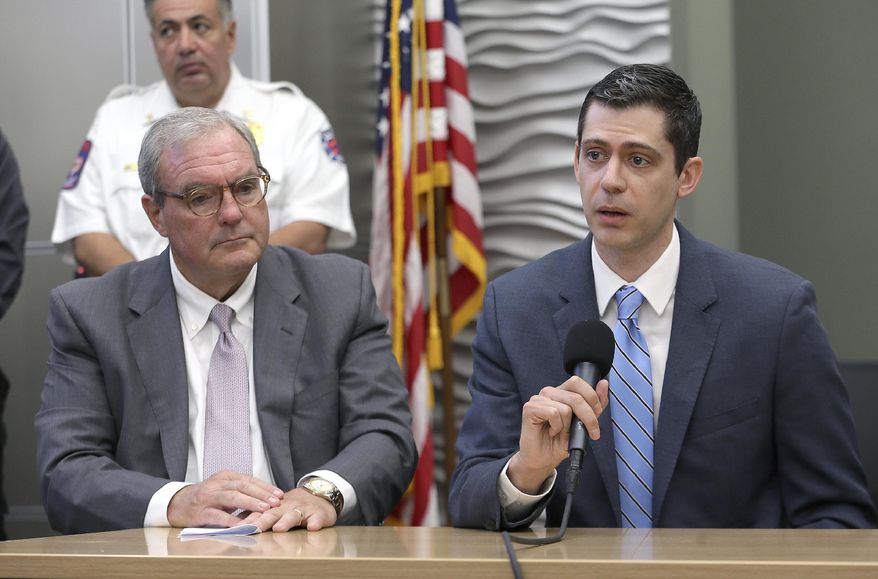 U.S. Attorney for the Western District of Texas John Bash said they would seek the death penalty in the mass shooting at Walmart in El Paso, Texas during a press conference Sunday, Aug. 4, 2019 at the Office of Emergency Management. Patrick Crusius was booked on charges of capital murder. El Paso Mayor Dee Margo is at left. (Mark Lambie/The El Paso Times via AP)
