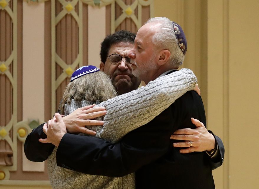 Rabbi Jeffrey Myers (right) said his Tree of Life Synagogue in Pittsburgh is compiling a book to help communities cope with mass shootings. (Associated Press/File)