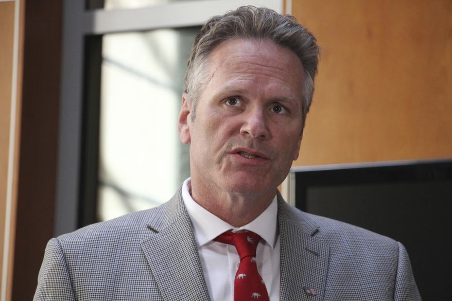 Alaska Gov. Mike Dunleavy speaks at a news conference Monday, Aug. 5, 2019, in Anchorage, Alaska. State health department officials discussed proposals they are seeking for a study on the feasibility of privatizing Alaska's state-owned psychiatric hospital and announced the Alaska Psychiatric Institute is in good standing with federal requirements. (AP Photo/Mark Thiessen)