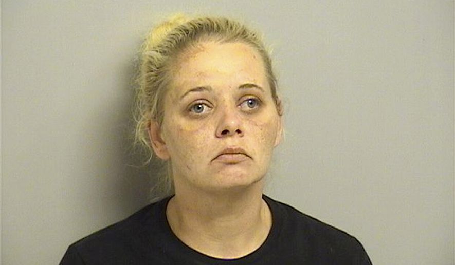 This Sunday, Aug. 4, 2019 booking photo provided by the Tulsa County Sheriff's Office shows Angie West, who authorities say has been arrested after one man was electrocuted and a second man was severely shocked while the trio allegedly tried to steal copper from a radio station transmitter in Sand Springs, about 7 miles west of Tulsa. (Tulsa County Sheriff via AP)