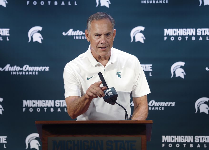 Michigan State football coach Mark Dantonio talks with reporters during the team's NCAA college football media day, Monday, Aug. 5, 2019, in East Lansing, Mich. (AP Photo/Al Goldis)