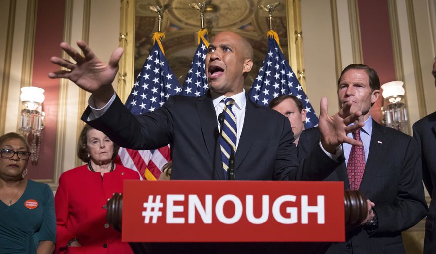 Sen. Cory Booker, D-N.J., center, calls for gun control legislation in the wake of the mass shooting in an Orlando LGBT nightclub this week, Thursday, June 16, 2016, during a news conference on Capitol Hill in Washington. From left are, Rev. Sharon Risher, a clinical trauma chaplain in Dallas, who lost her mother Ethel Lance and two cousins in the racially-motivated shooting at the historic Emanuel AME Church in Charleston, N.C., in 2015, Sen. Dianne Feinstein, D-Calif., Sen. Chris Murphy, D-Conn., and Sen. Richard Blumenthal, D-Conn. (AP Photo/J. Scott Applewhite)