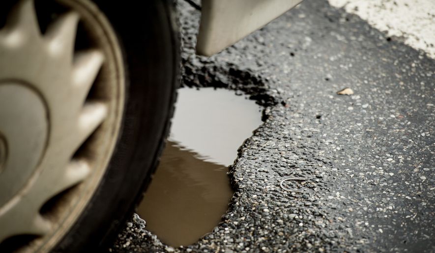 potholes along Florida Ave. in Northwest, Washington, D.C., Wednesday, March 19, 2014. (Andrew Harnik/The Washington Times) **FILE**