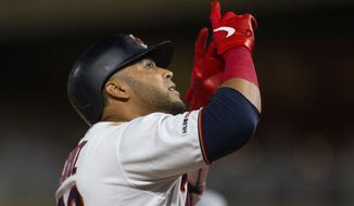 Minnesota Twins&#39; Nelson Cruz celebrates after hitting a home run during sixth inning against the Atlanta Braves during a baseball game Tuesday, Aug. 6, 2019, in Minneapolis. (AP Photo/Andy Clayton- King)