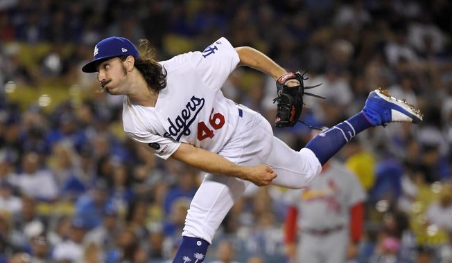 Los Angeles Dodgers starting pitcher Tony Gonsolin throws to the plate during the fifth inning of a baseball game against the St. Louis Cardinals Monday, Aug. 5, 2019, in Los Angeles. (AP Photo/Mark J. Terrill)