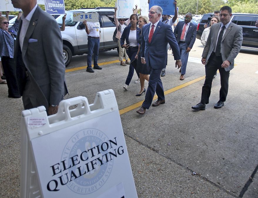 Louisiana Governor John Bel Edwards and his wife Donna arrive at the Louisiana Secretary of State&#x27;s office to sign up to run in the upcoming election, in Baton Rouge, La., Tuesday, August 6, 2019. The candidate sign-up period for Louisiana&#x27;s statewide elections ends Thursday, with the governor&#x27;s race at the top of the ballot. (AP Photo/Michael DeMocker)