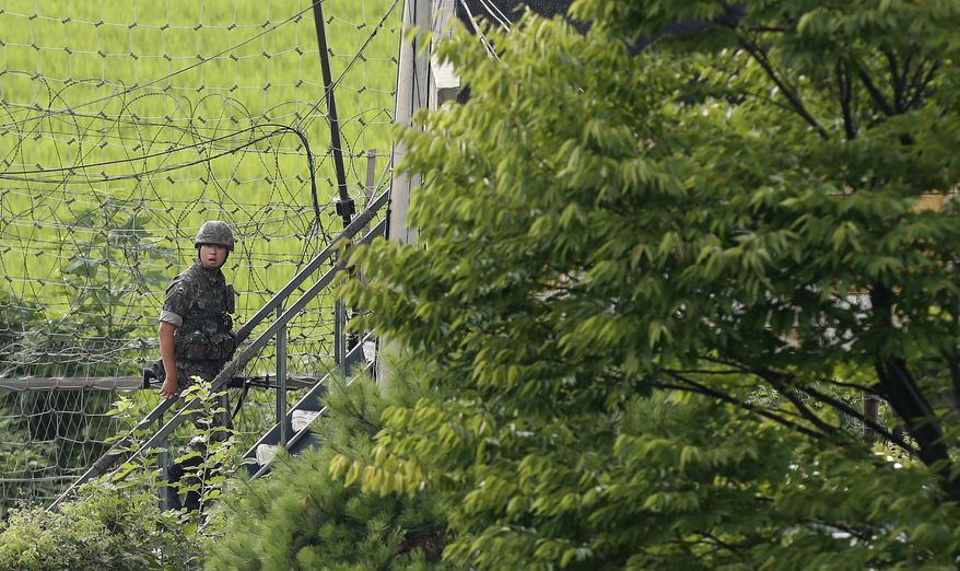 A South Korean army soldier walks up the stairs of a military post at the Imjingak Pavilion, near the demilitarized zone of Panmunjom, in Paju, South Korea, Tuesday, Aug. 6, 2019. North Korea continued to ramp up its weapons demonstrations by firing two presumed short-range ballistic missiles into the sea Tuesday while lashing out at the United States and South Korea for continuing military exercises that the North says could derail fragile nuclear diplomacy. (AP Photo/Ahn Young-joon)
