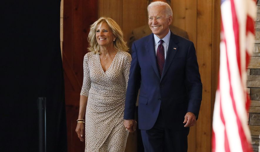 Democratic presidential candidate former Vice President Joe Biden arrives with his wife Jill to speak at a community event, Wednesday, Aug. 7, 2019, in Burlington, Iowa. (AP Photo/Charlie Neibergall)