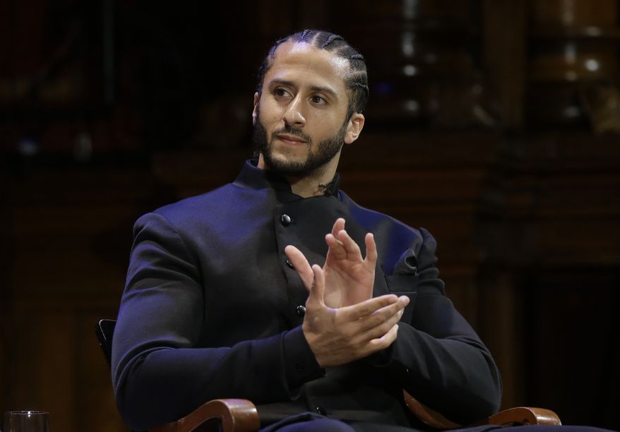  In this Oct. 11, 2018, file photo, former NFL football quarterback Colin Kaepernick applauds while seated on stage during W.E.B. Du Bois Medal ceremonies at Harvard University in Cambridge, Mass. Colin Kaepernick says he&#x27;s &quot;still ready&quot; to return to the NFL, even though he is set to enter his third season out of the league. In a video posted Wednesday, Aug. 7, 2019 on social media, the 31-year-old Kaepernick is shown working out in a gym. He says in the video: &quot;5 a.m. 5 days a week. For 3 years. Still Ready.&quot; (AP Photo/Steven Senne, File) **FILE**