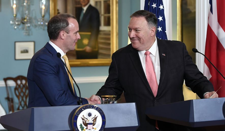 Secretary of State Mike Pompeo, right, shakes hands with Britain&#39;s Foreign Secretary Dominic Raab, left, during a press availability at the State Department in Washington, Wednesday, Aug. 7, 2019. (AP Photo/Susan Walsh)