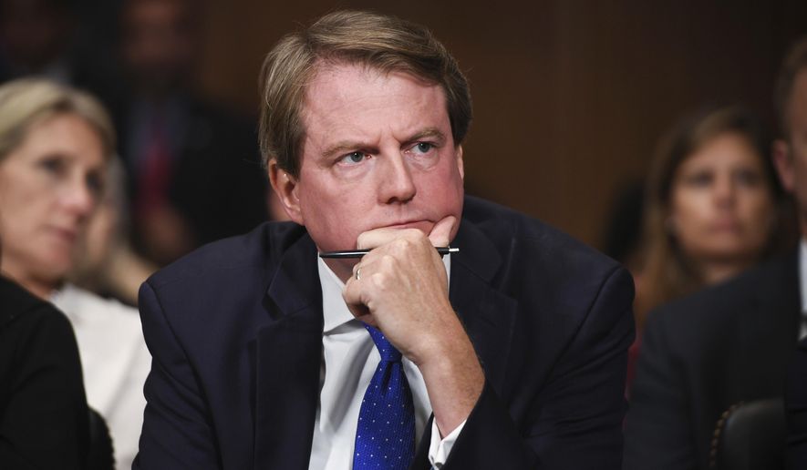 In this Sept. 27, 2018, file photo, then-White House counsel Don McGahn listens as Supreme Court nominee Brett Kavanaugh testifies before the Senate Judiciary Committee on Capitol Hill in Washington. (Saul Loeb/Pool Photo via AP) **FILE**