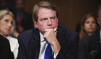 In this Sept. 27, 2018, file photo, then-White House counsel Don McGahn listens as Supreme Court nominee Brett Kavanaugh testifies before the Senate Judiciary Committee on Capitol Hill in Washington. (Saul Loeb/Pool Photo via AP) **FILE**