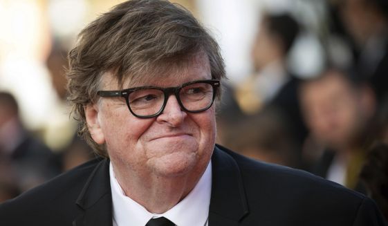 This May 25, 2019, file photo shows Michael Moore at the awards ceremony of the 72nd international film festival, Cannes, southern France. (Photo by Vianney Le Caer/Invision/AP, File)