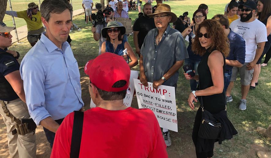 Democratic presidential candidate Beto O'Rourke, meets with residents of El Paso, Texas, after a community "unity" rally a few blocks from the University Medical Center of El Paso where victims of Saturday's shooting are being treated Wednesday, Aug. 7, 2019. Speaking to several hundred people, O'Rourke said immigrants had made El Paso one of the safest cities in America, before Saturday's shooting. (AP Photo/Morgan Lee)