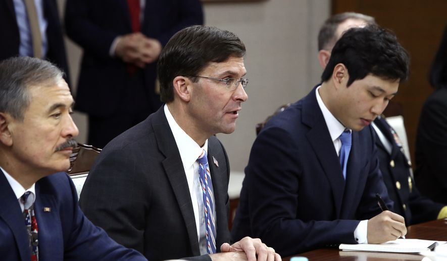 U.S. Defense Secretary Mark Esper, center, holds a talk with South Korean Defense Minister Jeong Kyeong-doo during their meeting Friday, Aug. 9, 2019 in Seoul, South Korea(Pool Photo via AP)