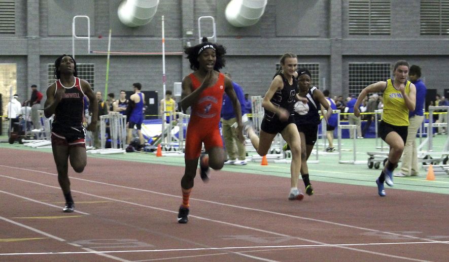 In this Feb. 7, 2019 file photo, Bloomfield High School transgender athlete Terry Miller, second from left, wins the final of the 55-meter dash over transgender athlete Andraya Yearwood, far left, and other runners in the Connecticut girls Class S indoor track meet at Hillhouse High School in New Haven, Conn. The federal Office for Civil Rights has launched an investigation into Connecticut's policy allowing transgender high school athletes to compete as the gender with which they identify. The investigation follows a complaint by the families of three girls, who say they were discriminated against by having to compete in track against two athletes who were identified as male at birth. They say that violates Title IX, the federal law designed to ensure equal athletic opportunities for females. (AP Photo/Pat Eaton-Robb) **FILE**