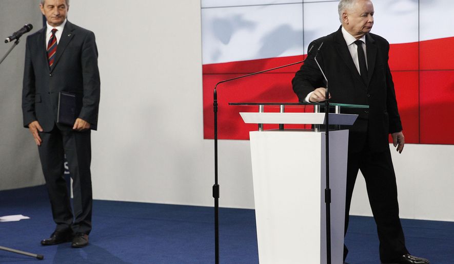 Jaroslaw Kaczynski,right, the head of Poland's ruling party, and parliament speaker Marek Kuchcinski after at a news conference where Kuchcinski announces his resignation in Warsaw, Poland, on Thursday Aug. 8, 2019. Kuchcinski's resignation was prompted by public anger over his and his family's frequent use of government aircraft. Kuchcinski and Kaczynski insisted that the speaker had broken no law and did nothing wrong but that they were acting in response to the public anger.(AP Photo/Czarek Sokolowski)