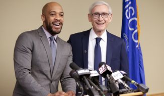 FILE - In this Jan. 3, 2019 file photo, Wisconsin Lt Gov-elect Mandela Barnes, left, and Democratic Gov-elect Tony Evers address the media in Madison, Wis. Lt. Gov. Barnes says he hasn&#39;t completed his degree at Alabama A&amp;amp;M University, though he completed coursework to resolve an incomplete class but never turned it in. Barnes&#39; biography on Gov. Evers&#39; website doesn&#39;t claim that he graduated. He says he&#39;s working to complete requirements. (Steve Apps/Wisconsin State Journal via AP, File)