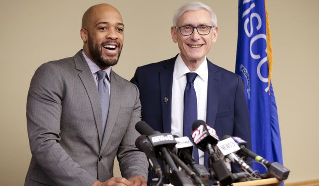 FILE - In this Jan. 3, 2019 file photo, Wisconsin Lt Gov-elect Mandela Barnes, left, and Democratic Gov-elect Tony Evers address the media in Madison, Wis. Lt. Gov. Barnes says he hasn&#x27;t completed his degree at Alabama A&amp;amp;M University, though he completed coursework to resolve an incomplete class but never turned it in. Barnes&#x27; biography on Gov. Evers&#x27; website doesn&#x27;t claim that he graduated. He says he&#x27;s working to complete requirements. (Steve Apps/Wisconsin State Journal via AP, File)