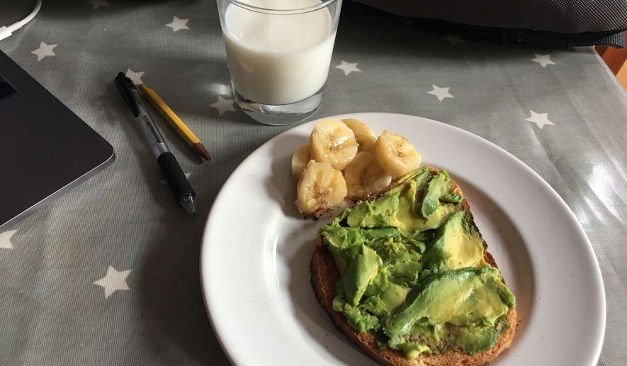 This July 31, 2019 photo shows avocado toast, banana and a glass of milk on a table in the Brooklyn borough of New York. Whole grain toast with avocado is a fast but nutritious school-morning breakfast, and parents can add a hard-boiled egg for extra protein. (Melissa Rayworth via AP)