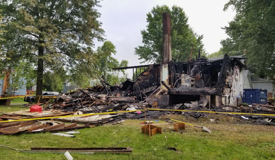 This photo shows the destroyed house of Angela and Brad Frase after an explosion in Sterling, Ohio, Thursday, Aug. 8, 2019. Angela, a black woman who has lived in the small Ohio community with her white husband for more than 20 years, says they've never experienced any prejudice before racial slurs and swastikas were spray painted on their garage and their house was reduced to rubble by an explosion. (Jack Rooney/The Daily Record via AP)
