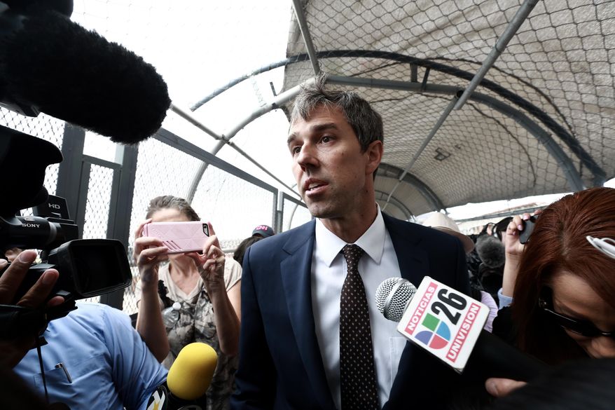 Democratic presidential candidate Beto O'Rourke is surrounded by reporters as he walks on an international bridge to cross into Ciudad Juarez, Mexico, Thursday, Aug. 8, 2019. O’Rourke has crossed the border into Mexico for the funeral of one of the 22 people killed in a mass shooting at a Walmart in El Paso, Texas. (AP Photo/Christian Chavez) **FILE**
