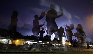 In this Aug. 20, 2014, file photo, protesters march in the street as lightning flashes in the distance in Ferguson, Mo. Michael Brown&#39;s death on Aug. 9, 2014, at the hands of a white Missouri police officer stands as a seismic moment of race relations in America. The fledgling Black Lives Matter movement found its voice, police departments fell under intense scrutiny, progressive prosecutors were elected and court policies revised. (AP Photo/Jeff Roberson, File)