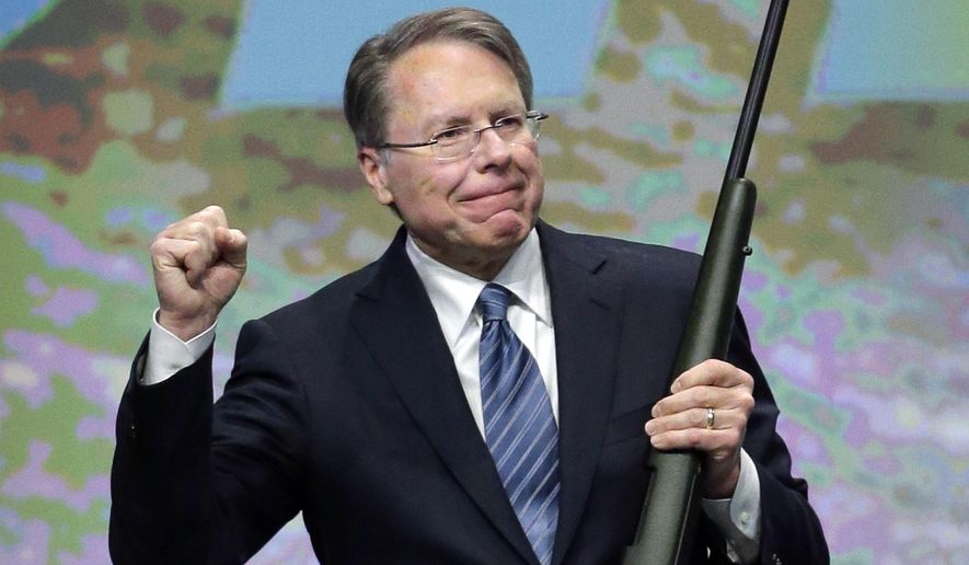 FILE - In this Feb. 23, 2013, file photo, Wayne LaPierre, executive vice president of the National Rifle Association, holds a custom 300 Remington ultra mag during a gun auction after speaking during the Western Hunting &amp;amp; Conservation Expo Banquet at the Salt Palace Convention Center in Salt Lake City. In the latest national furor over mass killings, the tremendous political power of the NRA is likely to stymie any major changes to gun laws. The man behind the organization is LaPierre, the public face of the Second Amendment with his bombastic defense of guns, freedom and country in the aftermath of every mass shooting. (AP Photo/Rick Bowmer, File)