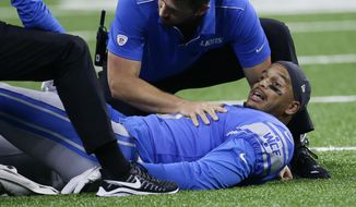 Detroit Lions wide receiver Jermaine Kearse is examined during the first half of the team&#x27;s preseason NFL football game against the New England Patriots, Thursday, Aug. 8, 2019, in Detroit. (AP Photo/Duane Burleson)