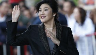 FILE - In this Tuesday, Aug. 1, 2017 file photo, Thailand&#39;s former Prime Minister Yingluck Shinawatra waves to supporters as she arrives at the Supreme Court in Bangkok, Thailand. Serbian media say fugitive former Thai Prime Minister Yingluck Shinawatra has received Serbian citizenship. State news agency Tanjug said Thursday, Aug. 8, 2019 that the Serbian government granted her the citizenship “because it could be in the interest of Serbia.” (AP Photo/Sakchai Lalit, file)