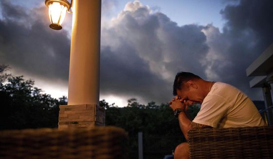 Walter Denton prays as the sun rises in his backyard in Agat, Guam, Saturday, May 11, 2019. Denton is one of over 200 former altar boys, students and Boy Scouts who are now suing Guam&#39;s Catholic archdiocese over decades of sexual abuse they say they suffered at the hands of almost three dozen clergy, teachers and scoutmasters. &amp;quot;He took everything from me. From that day forward my demeanor changed. I break down, I hurt everyday and I still hurt,&amp;quot; said Denton. But, he adds, &amp;quot;he didn&#39;t ruin my faith. I still believe in God.&amp;quot; Former Archbishop of Agana, Anthony Apuron denies the allegations. (AP Photo/David Goldman)
