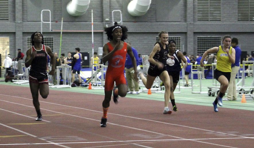 In this Feb. 7, 2019 file photo, Bloomfield High School transgender athlete Terry Miller, second from left, wins the final of the 55-meter dash over transgender athlete Andraya Yearwood, far left, and other runners in the Connecticut girls Class S indoor track meet at Hillhouse High School in New Haven, Conn. The federal Office for Civil Rights has launched an investigation into Connecticut's policy allowing transgender high school athletes to compete as the gender with which they identify. The investigation follows a complaint by the families of three girls, who say they were discriminated against by having to compete in track against two athletes who were identified as male at birth. They say that violates Title IX, the federal law designed to ensure equal athletic opportunities for females. (AP Photo/Pat Eaton-Robb, File)