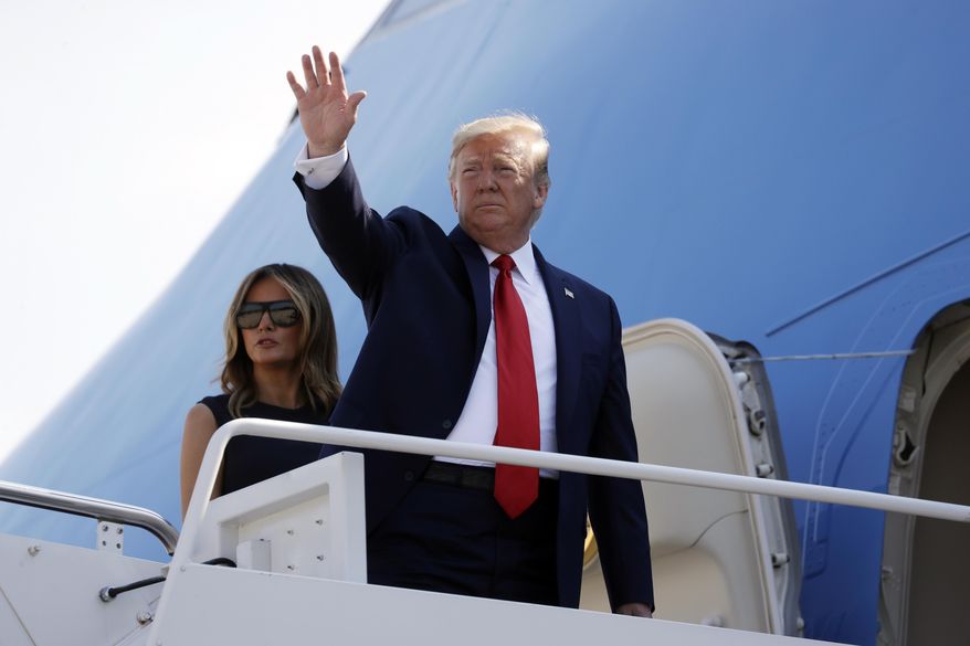 In this Aug. 7, 2019, photo, President Donald Trump and first lady Melania Trump board Air Force One for a trip to Dayton, Ohio and El Paso, Texas, at Andrews Air Force Base, Md. As Trump prepares to leave Friday for his annual August holiday at his lush New Jersey golf club, the president will confront a storm of crises, at home and abroad, that could set the course for his upcoming re-election bid. (AP Photo/Evan Vucci)