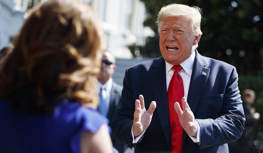 President Donald Trump talks to reporters on the South Lawn of the White House, Friday, Aug. 9, 2019, in Washington, as he prepares to leave Washington for his annual August holiday at his New Jersey golf club.  (AP Photo/Evan Vucci)