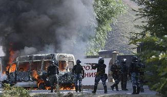 Kyrgyz riot police shoot rubber bullets to stop supporters of former president Almazbek Atambayev, near his residence in the village of Koi-Tash, about 20 kilometers (12 miles) south of the capital, Bishkek, Kyrgyzstan, Thursday, Aug. 8, 2019. Police in Kyrgyzstan detained the Central Asian nation&#39;s ex-president Thursday following violent clashes with his supporters, a day after a previous attempt to arrest him left one policeman dead and nearly 80 people injured. (AP Photo/Vladimir Voronin)