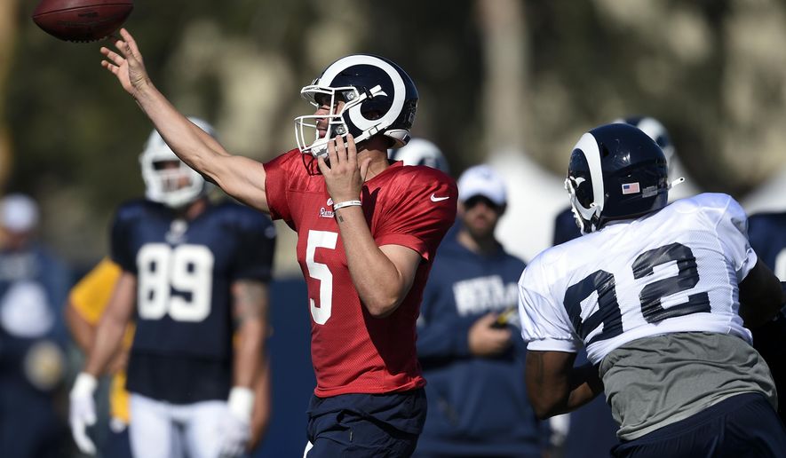 FILE - In this July 29, 2019, file photo, Los Angeles Rams quarterback Blake Bortles throws a pass during the NFL football team's training camp in Irvine, Calif. Bortles gets his first opportunity to show if an offseason with coach Sean McVay has led to improvement. Bortles signed with Los Angeles following his first five seasons in Jacksonville. (AP Photo/Kelvin Kuo, File)