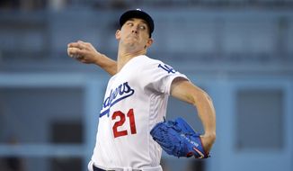 Los Angeles Dodgers starting pitcher Walker Buehler throws to the plate during the first inning of a baseball game against the Arizona Diamondbacks, Friday, Aug. 9, 2019, in Los Angeles. (AP Photo/Mark J. Terrill)