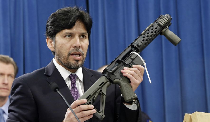 FILE - In this Jan. 13, 2014 file photo, former California State Sen. Kevin de Leon, D-Los Angeles, displays a homemade fully automatic rifle, confiscated by the Department of Justice, at the Capitol in Sacramento, Calif. California is among a handful of states taking tough actions to limit the availability of guns including military-style assault weapons, restrict the capacity of ammunition magazines and require background checks for purchasing bullets. But those steps and future gun control laws passed by Democratic-leaning states could face an uphill battle as the federal court system becomes increasingly dominated by conservative Republican appointees.(AP Photo/Rich Pedroncelli, File)