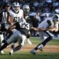 Los Angeles Rams quarterback Brandon Allen, right, evades a tackle by Oakland Raiders&#39; Jason Cabinda (53) during the first half of a preseason NFL football game Saturday, Aug. 10, 2019, in Oakland, Calif. (AP Photo/Rich Pedroncelli)