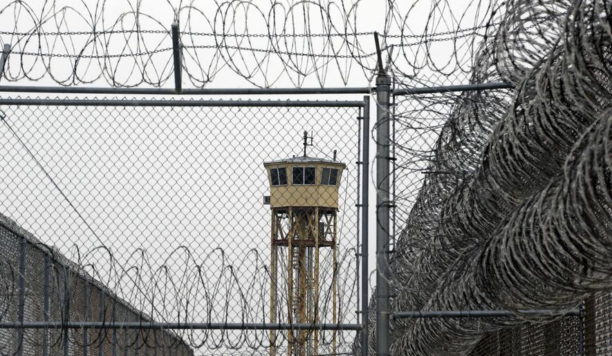 FILE - In this Feb. 25, 2015, file photo, a watch tower is seen at the Wasatch facility during a media tour at the Utah State Correctional Facility in Draper, Utah. Authorities say Utah is seeing a dramatic surge in their prison population as more people are convicted on new crimes and drug violations, KSL TV reports. (AP Photo/Rick Bowmer, Pool, File)