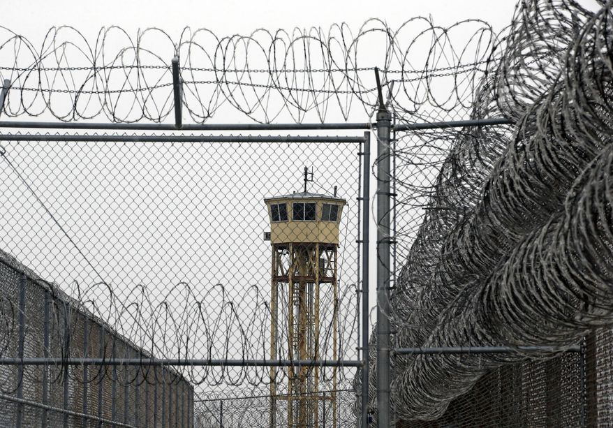 FILE - In this Feb. 25, 2015, file photo, a watch tower is seen at the Wasatch facility during a media tour at the Utah State Correctional Facility in Draper, Utah. Authorities say Utah is seeing a dramatic surge in their prison population as more people are convicted on new crimes and drug violations, KSL TV reports. (AP Photo/Rick Bowmer, Pool, File)