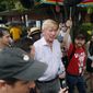 Republican presidential candidate and former Massachusetts Gov. Bill Weld, center, walks to the grand concourse during a visit to the Iowa State Fair, Sunday, Aug. 11, 2019, in Des Moines, Iowa. (AP Photo/Charlie Neibergall)
