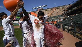 Baltimore Orioles&#39; Rio Ruiz is doused after a baseball game against the Houston Astros, Sunday, Aug. 11, 2019, in Baltimore. Ruiz hit a two-run walkout home run. The Orioles won 8-7. (AP Photo/Nick Wass)