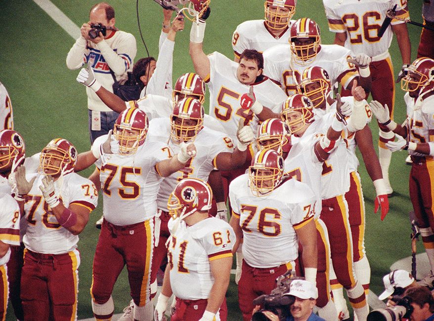 6. 1991 Redskins (won Super Bowl XXVI Redskins 37, Bills 24)                    
Members of the Washington Redskins football team give a thumb up salute to Detroit Lions Mike Utley just before start of Super Bowl XXVI in  Minneapolis Sunday, Jan. 26, 1992. Utley was paralyed from the neck down as a result of an injury earlier this season.(AP Photo/Fred Jewell)